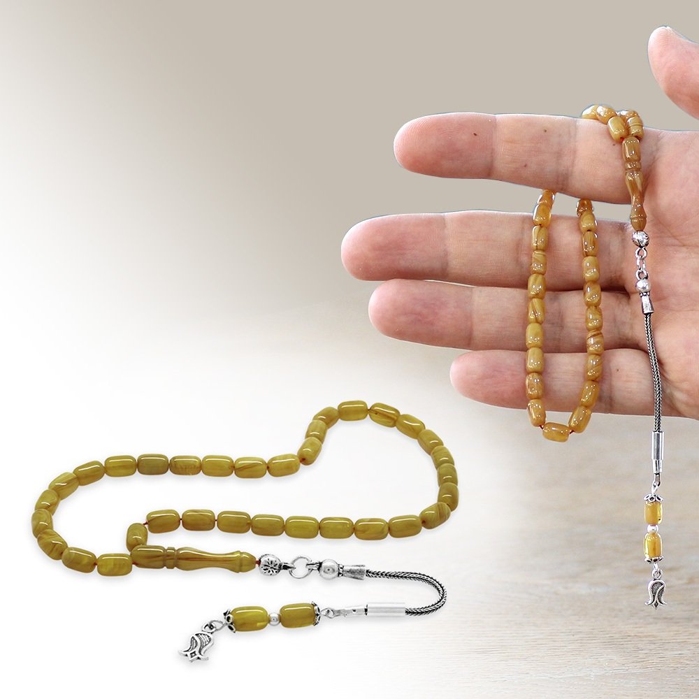 Amber tasbih held in hand