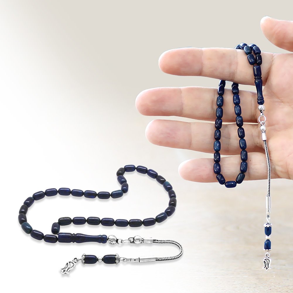 Pressed amber tasbih held in hand